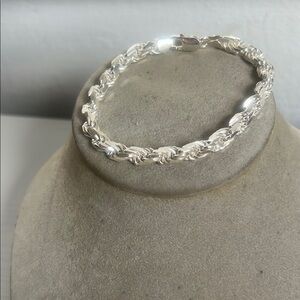 Intricate Silver Bracelet with Twisted Design